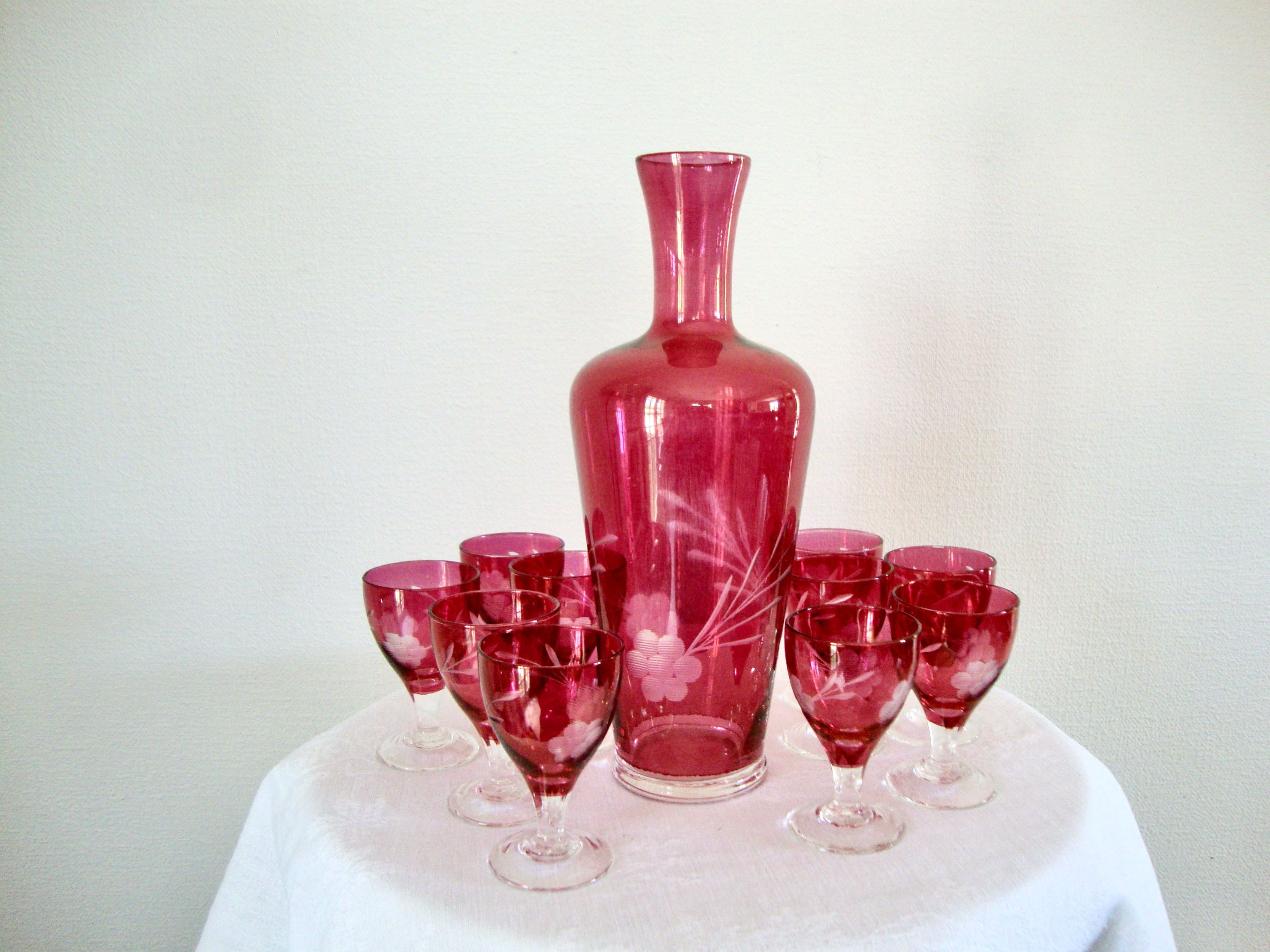 10 glasses and carafe with alcohol or liquor