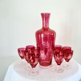 10 glasses and carafe with alcohol or liquor