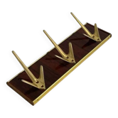 Coat rack or wall hook from the 1950s in wood and brass.