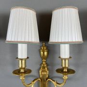 Set of three Louis XVI style wall sconces in gilded bronze, 20th century.