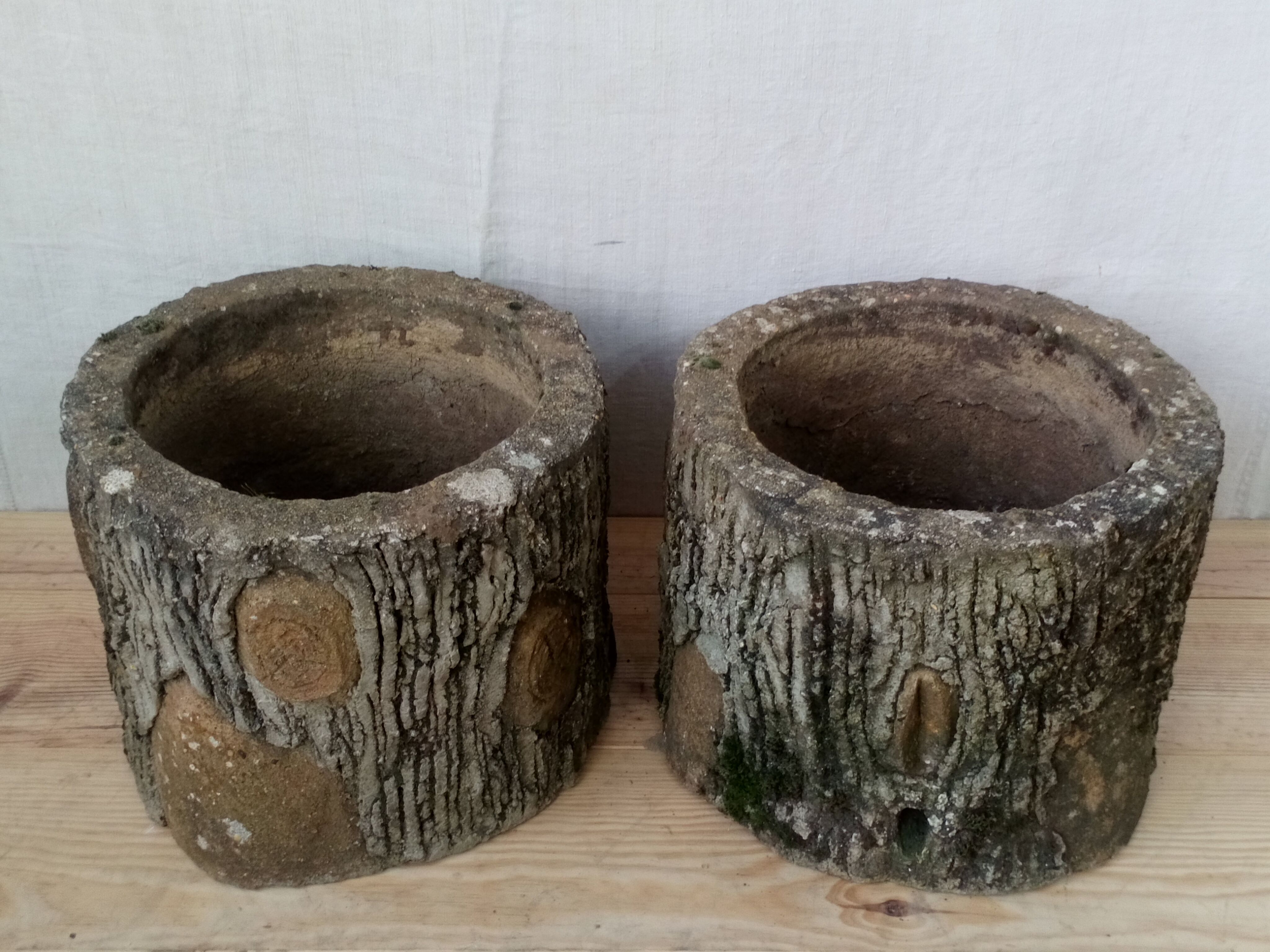 Pair of old rock garden planters in concrete