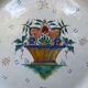 Old Gien earthenware scalloped plate with blue/yellow flower basket motifs
