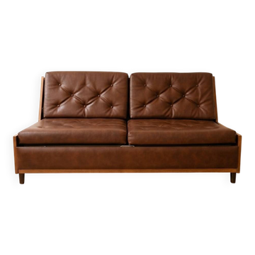Vintage 1970s clic-clac sofa bed in brown faux leather.