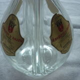 A liquor decanter has 4 compartments in glass