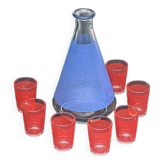 Liqueur service consisting of a blue screen-printed glass carafe and 7 small red glasses