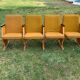 Set of 4 mid-century cinema seats in yellow fabric and light wood, 1950s.