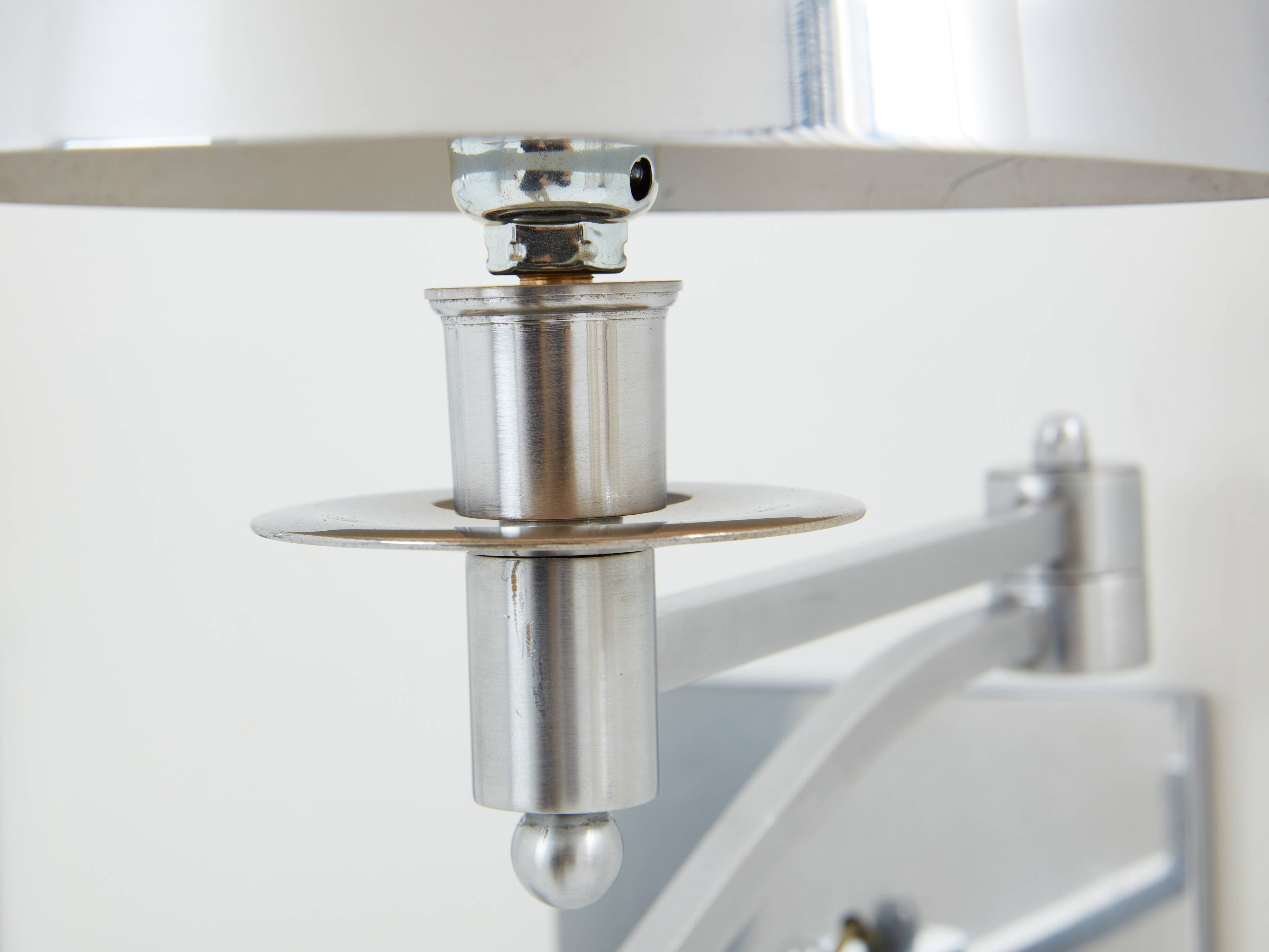 Pair of Maison Charles adjustable brushed steel wall lights circa 1960