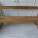 Church bench, bed end in pitch pine with light oak wax finish.