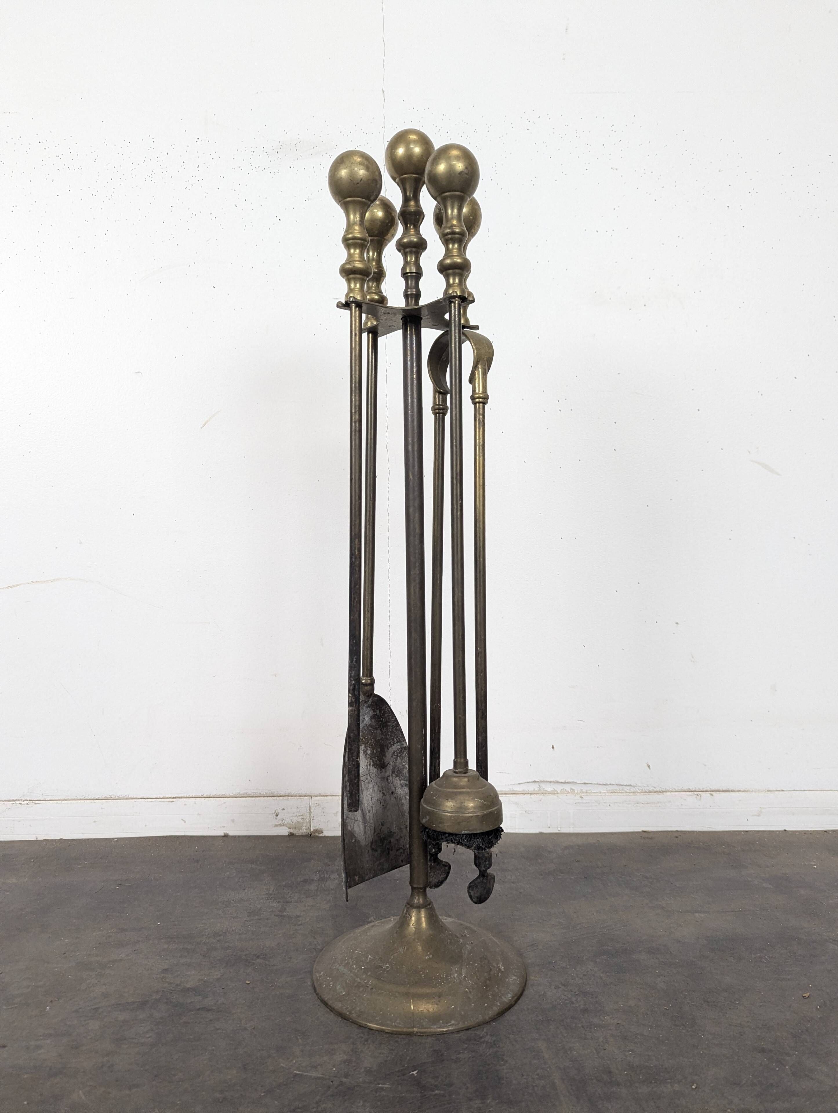 Brass fireplace tool set with four accessories