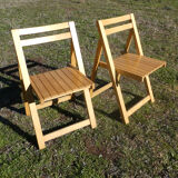 Pair of vintage folding chairs in light wood