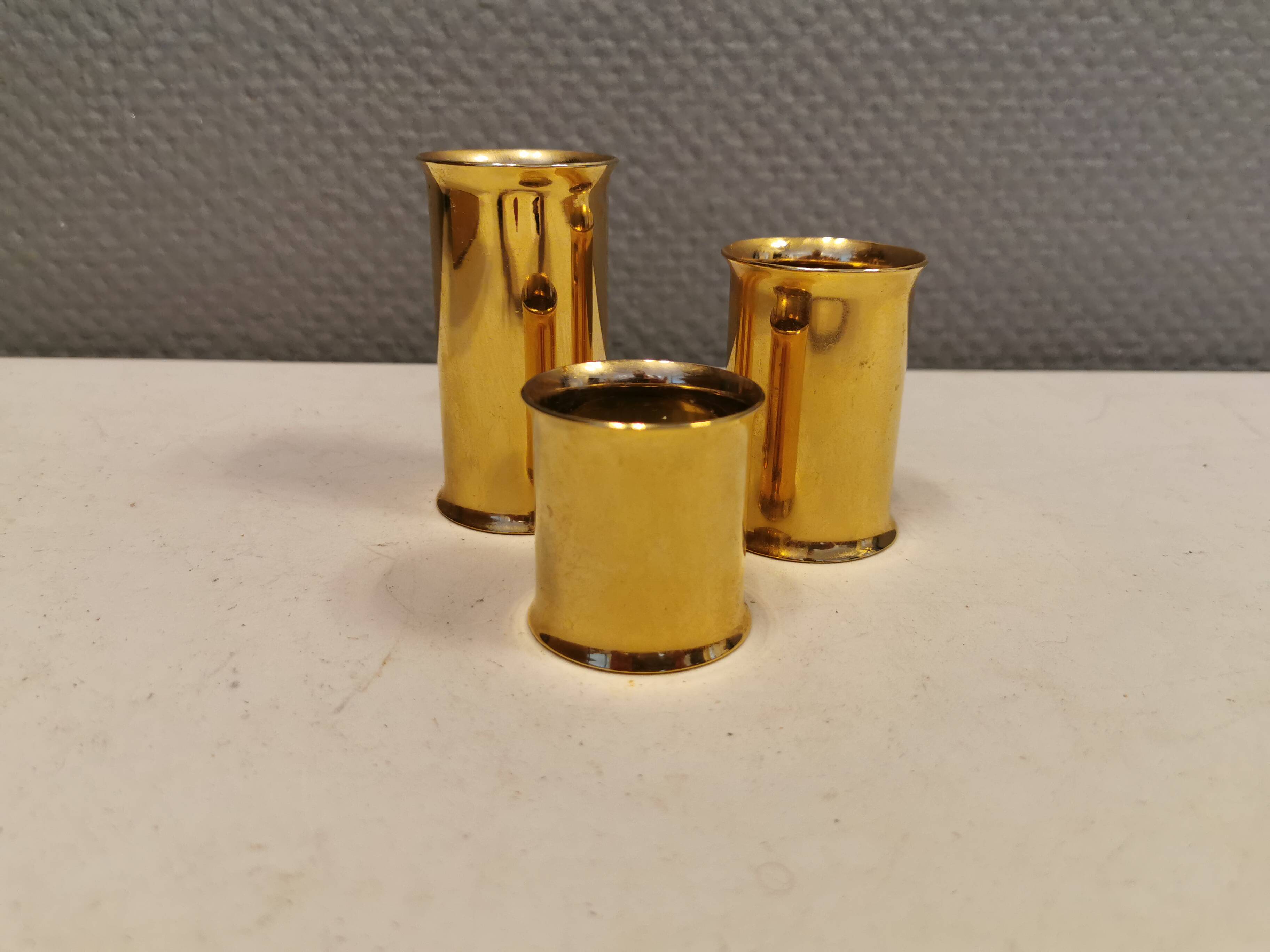 3 beautiful candle holders in 24 carat gold plating.  From Danish Altecco.