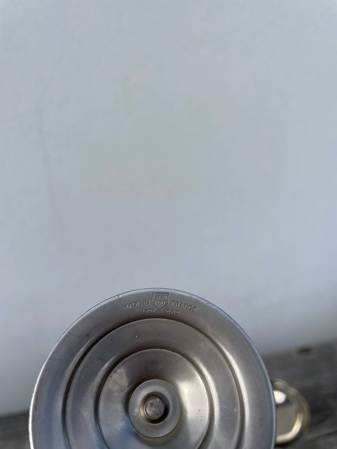 10 stainless steel cups signed Rémy Letang