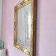 Richly carved antique gilded mirror