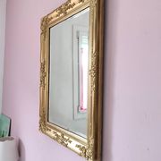 Miroir ancien doré richement sculpté