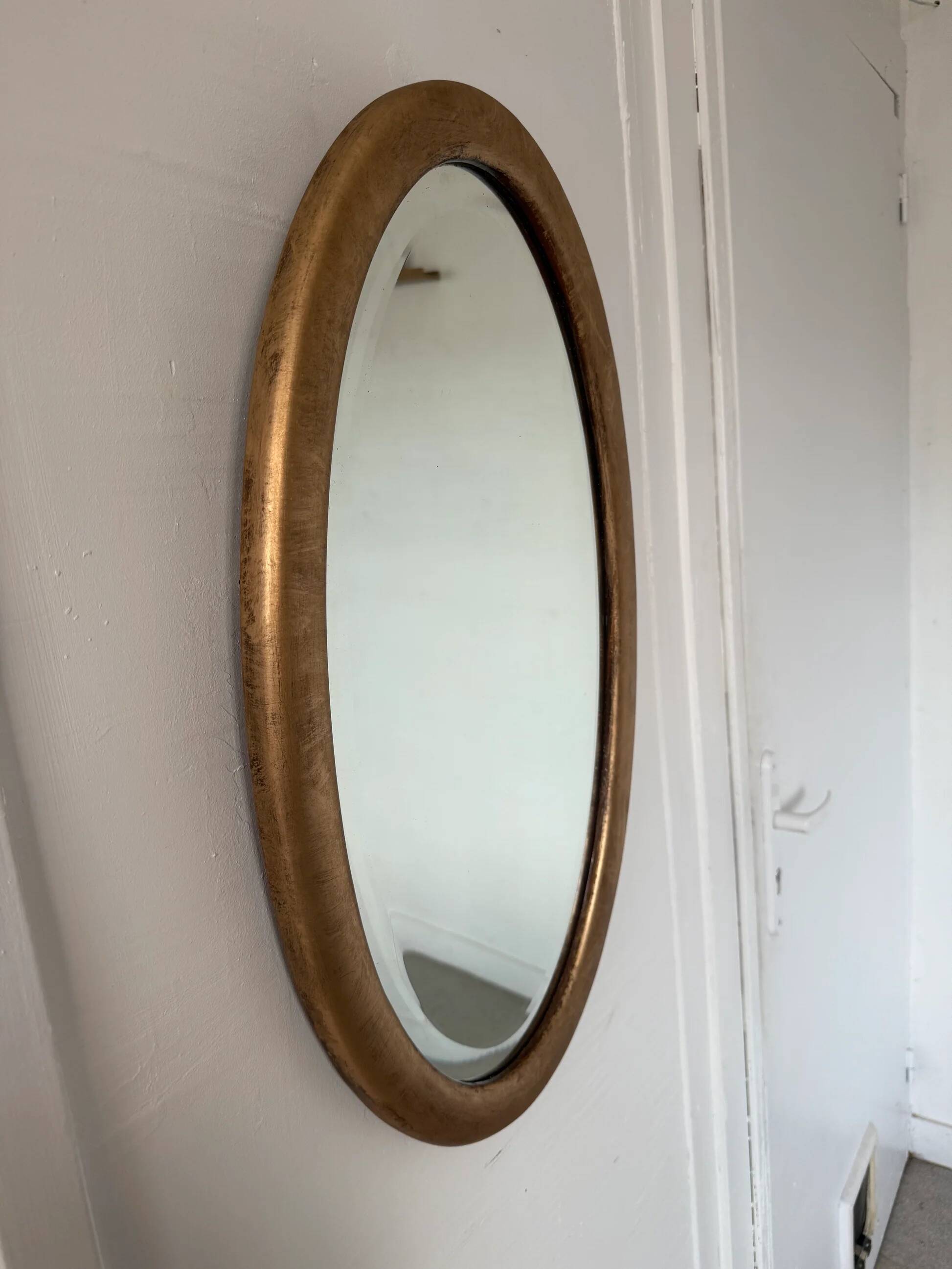 Miroir doré ovale ancien glace biseautée