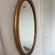 Miroir doré ovale ancien glace biseautée