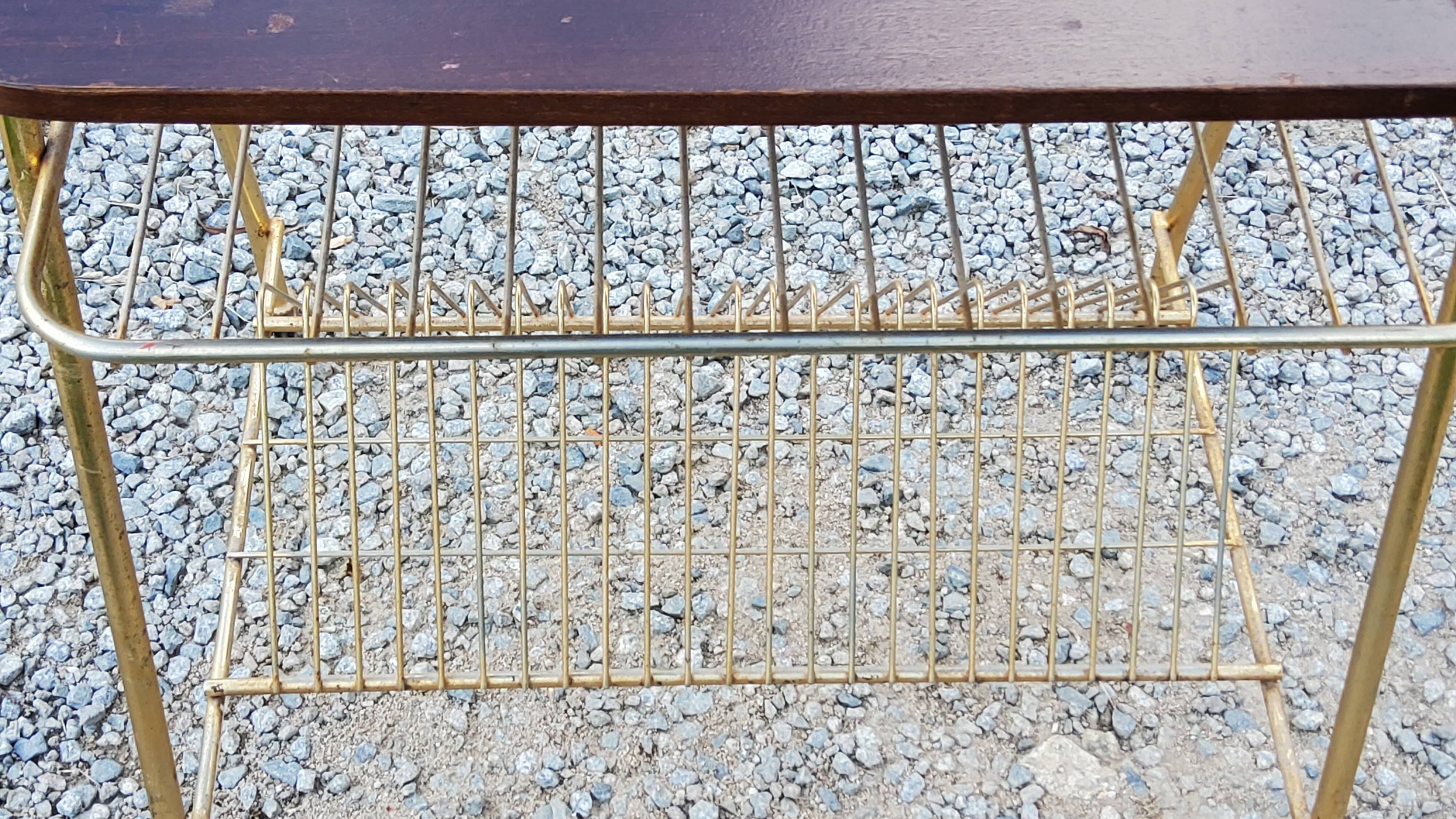 Side table of the 60s mahogany and gold metal range discs