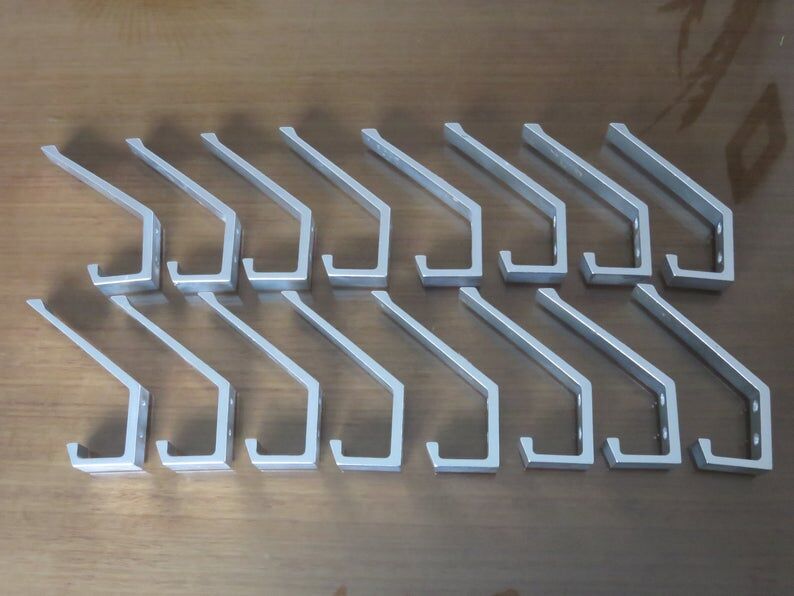 Series of 16 70s aluminium pads