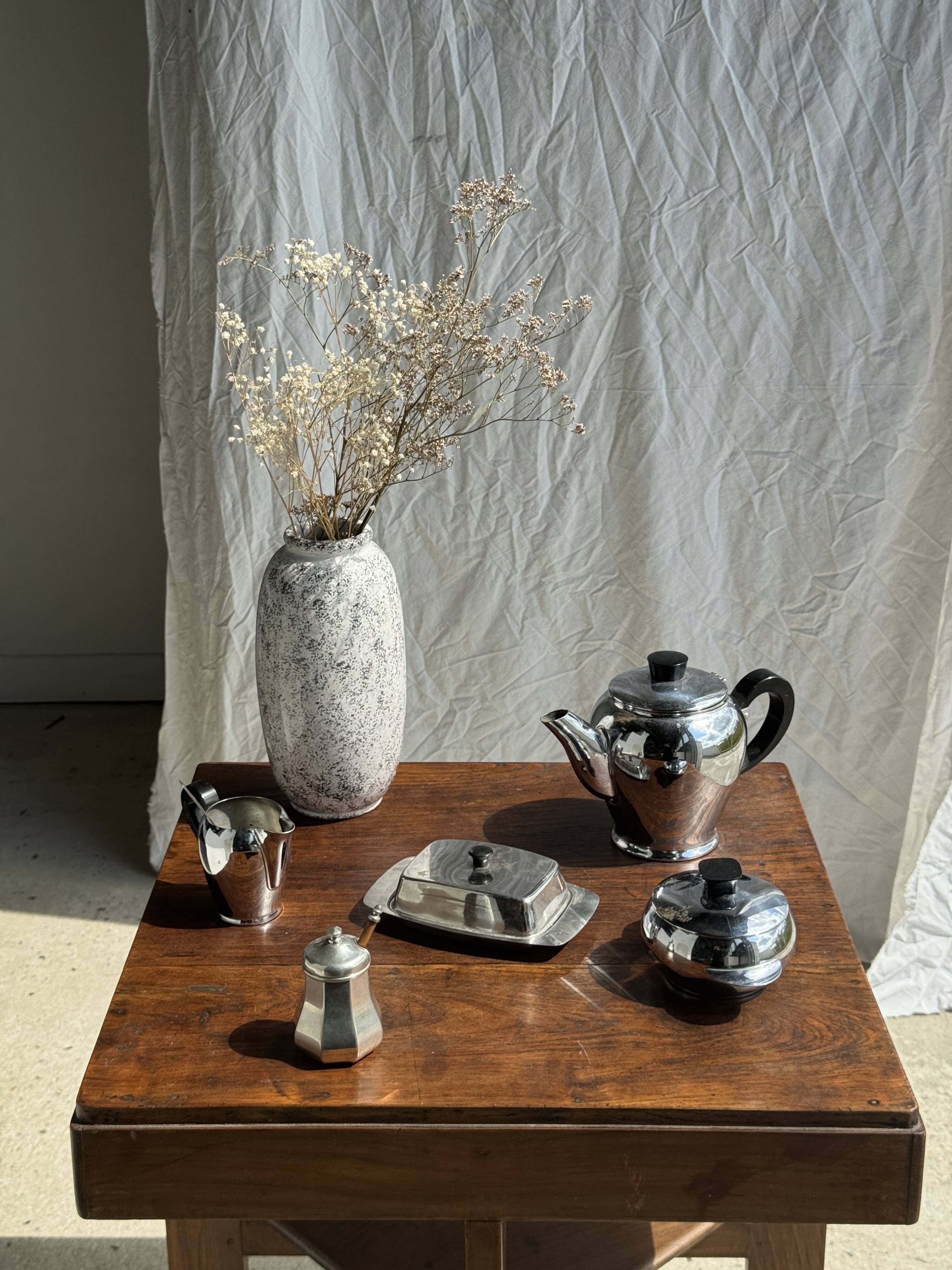 Tea set including teapot, milk jug, sugar bowl and butter dish