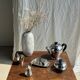 Tea set including teapot, milk jug, sugar bowl and butter dish