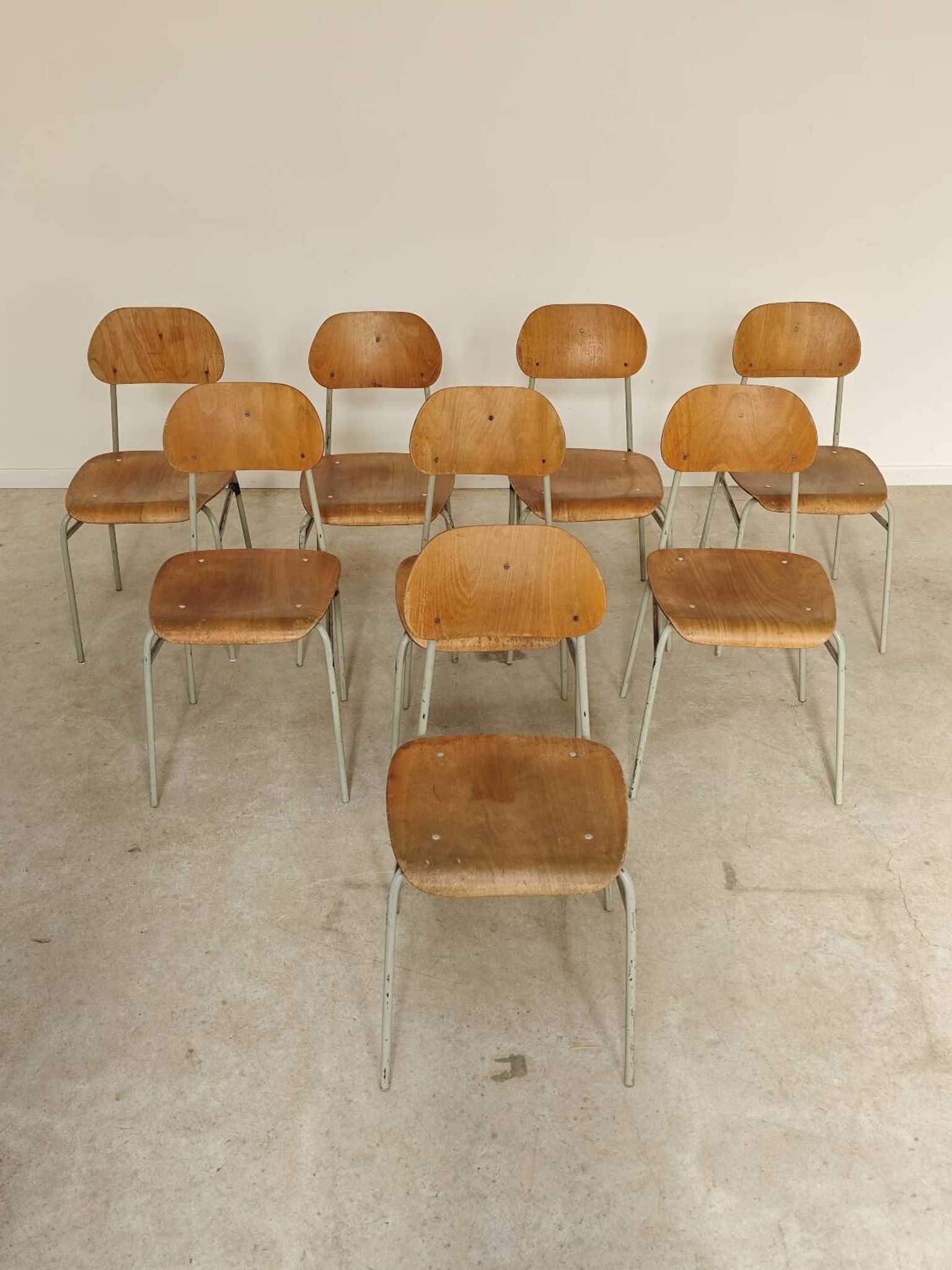 Set of 8 metal and wood school chairs  
Ex Czechoslovakia 1960