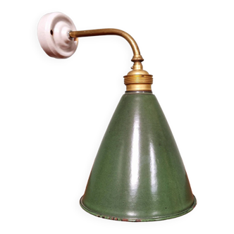 Industrial wall light in brass and porcelain with a conical shade in green enameled sheet metal