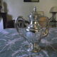 Empire-style silver metal teapot.