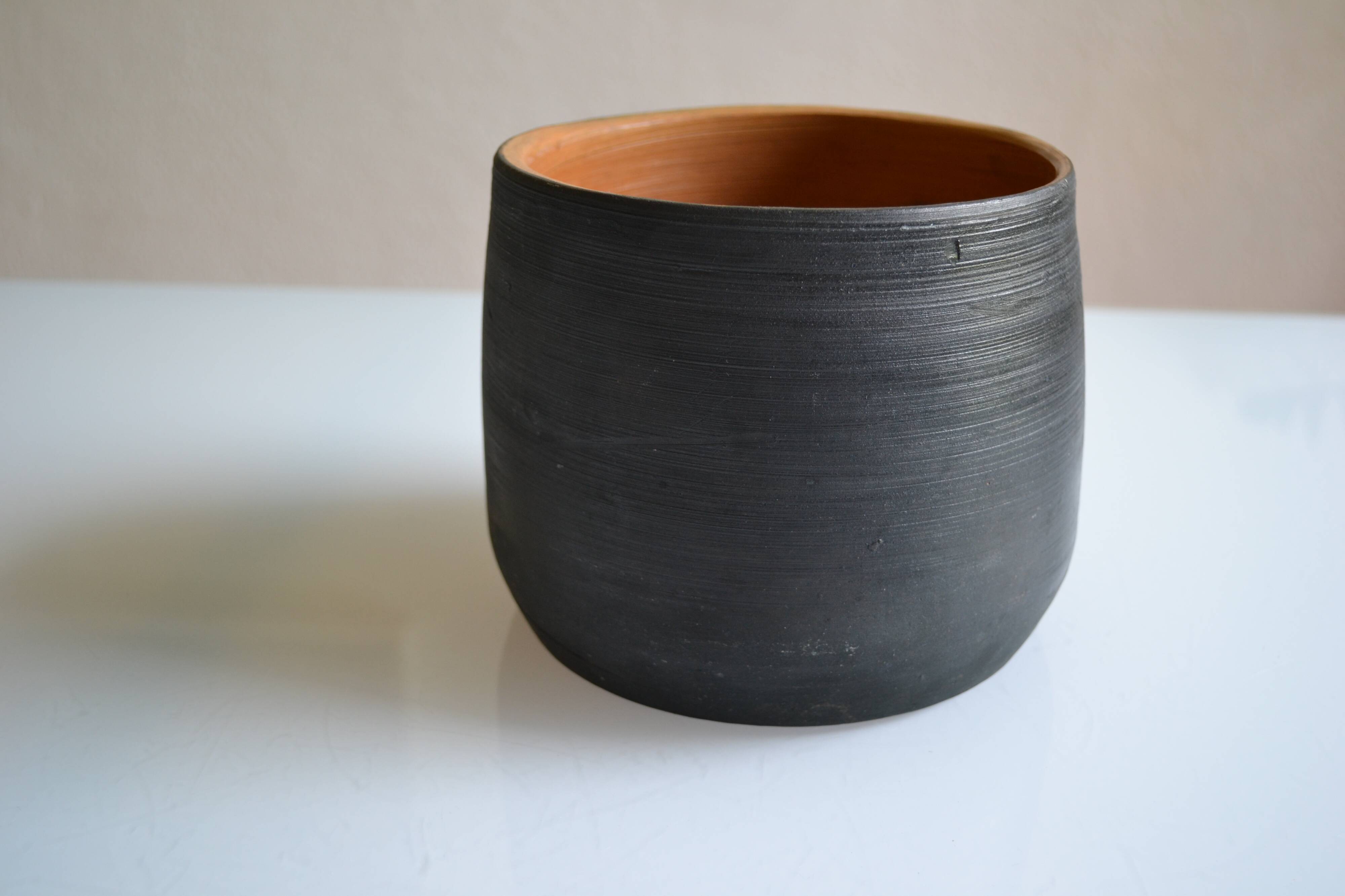 Ceramic cache pot or pocket emptying dish with a signature fish to identify.