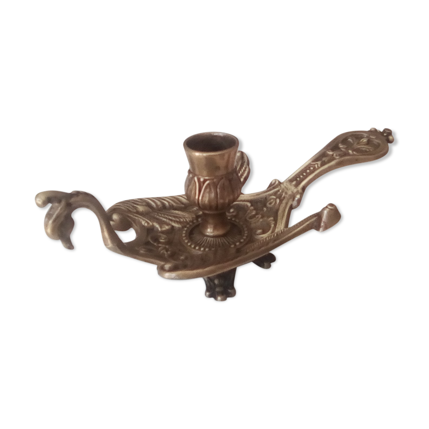 Old hand candlestick in chissed solid brass