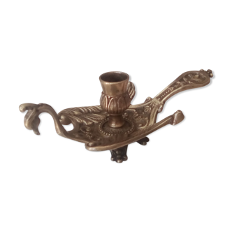 Old hand candlestick in chissed solid brass