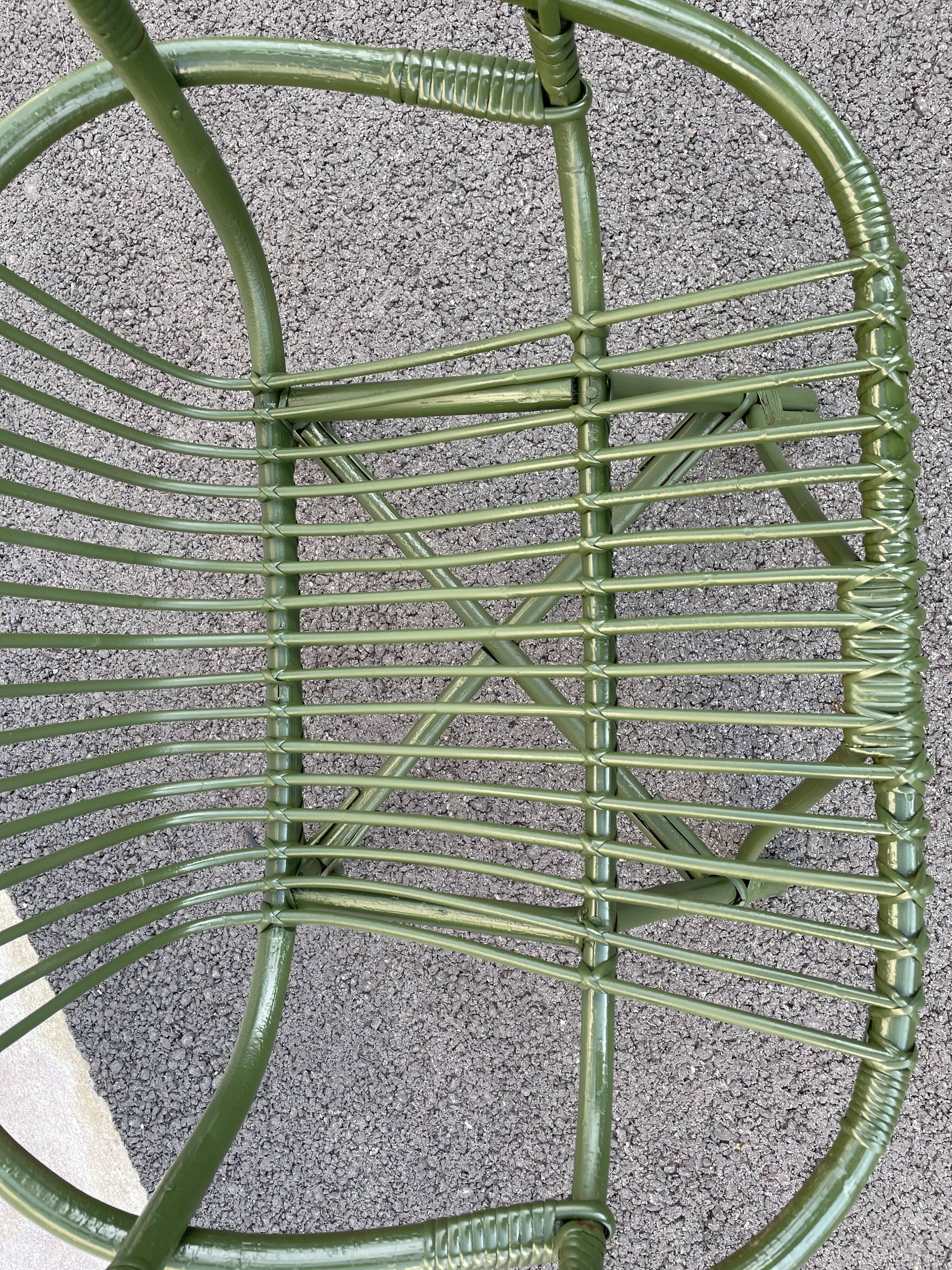 Green rattan armchair