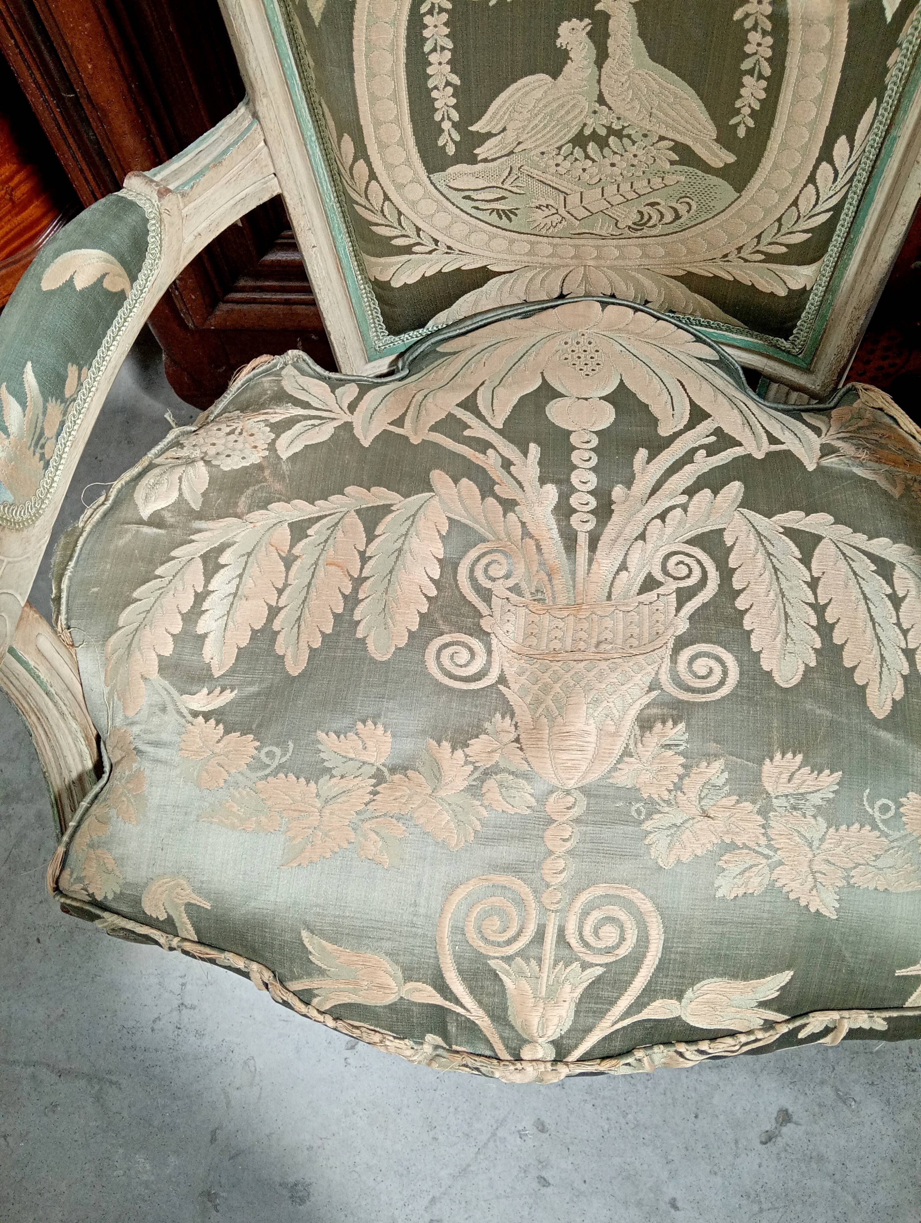 Pair of large Louis XVI armchairs in water green and cream wood.
