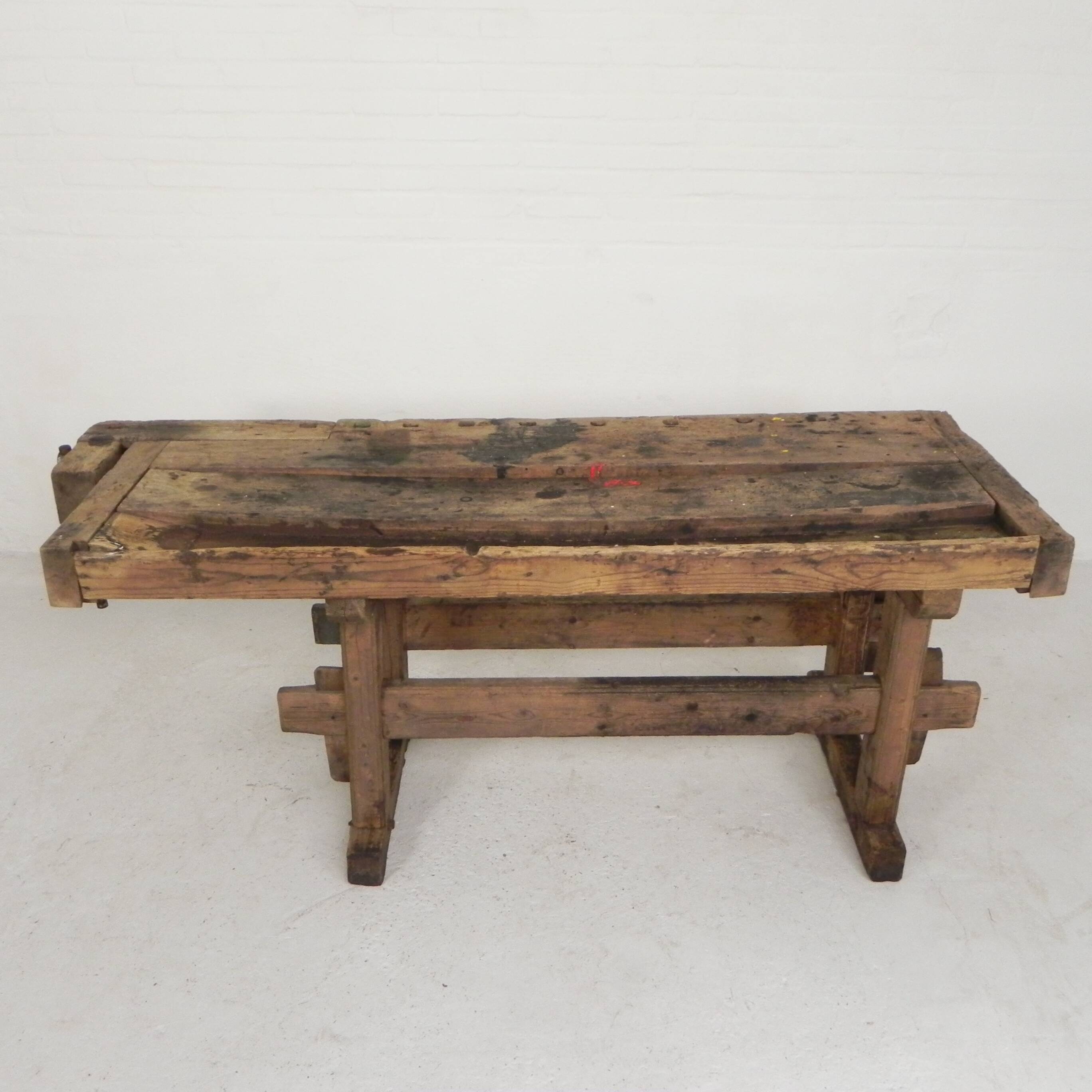 Wooden industrial workbench with vice, 194 cm long, 1930s.