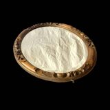 Antique oval beveled mirror in carved wood - 69 cm