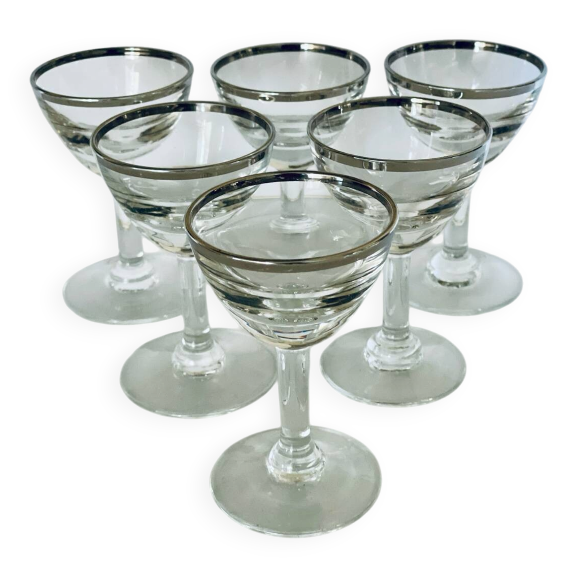 Set of 8 stemmed port glasses with silver trim.