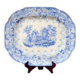 Grand plat décoratif en faïence bleue avec ruine d'abbaye début XIXe siècle.