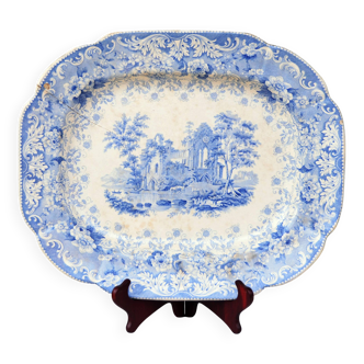 Grand plat décoratif en faïence bleue avec ruine d'abbaye début XIXe siècle.