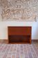 Vintage teak bar cabinet with black glass interior.