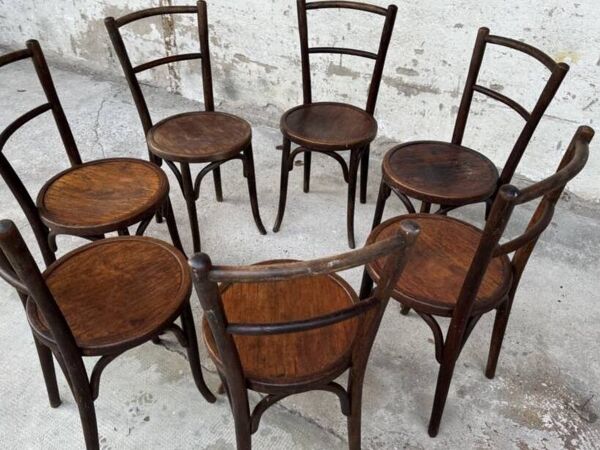 Série de 7 anciennes chaises bistrot Baumann bois courbé assise ronde