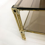 Table basse à deux niveaux en laiton Hollywood Regency Verre fumé en or des années 1970