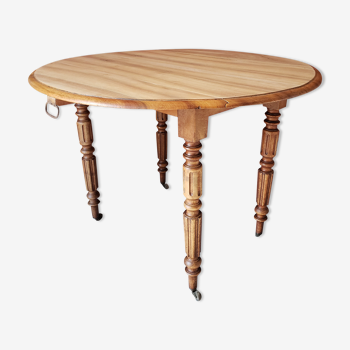 Old round table in walnut with flaps Louis Philippe