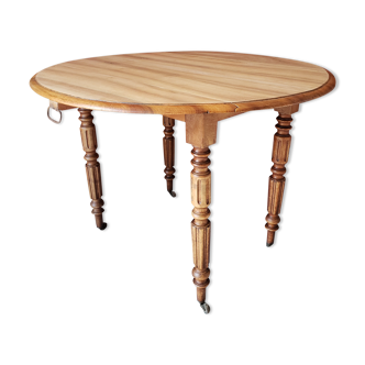 Old round table in walnut with flaps Louis Philippe