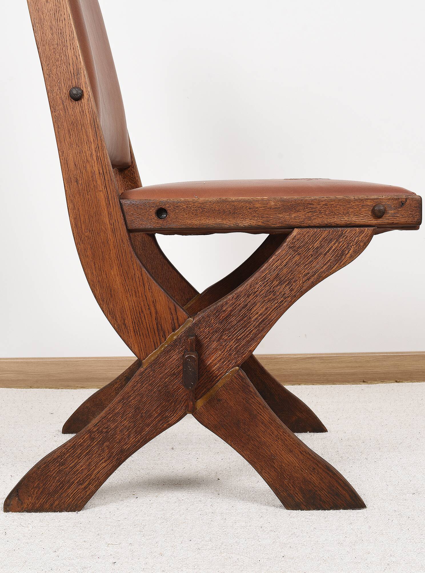 Pair of brutalist style chairs, in wood and leather.