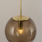 Large smoked glass ball pendant by Limburg in brass, Germany, 1970s.