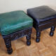 Pair of Moroccan poufs in stamped leather with a carved wooden base, Rabat