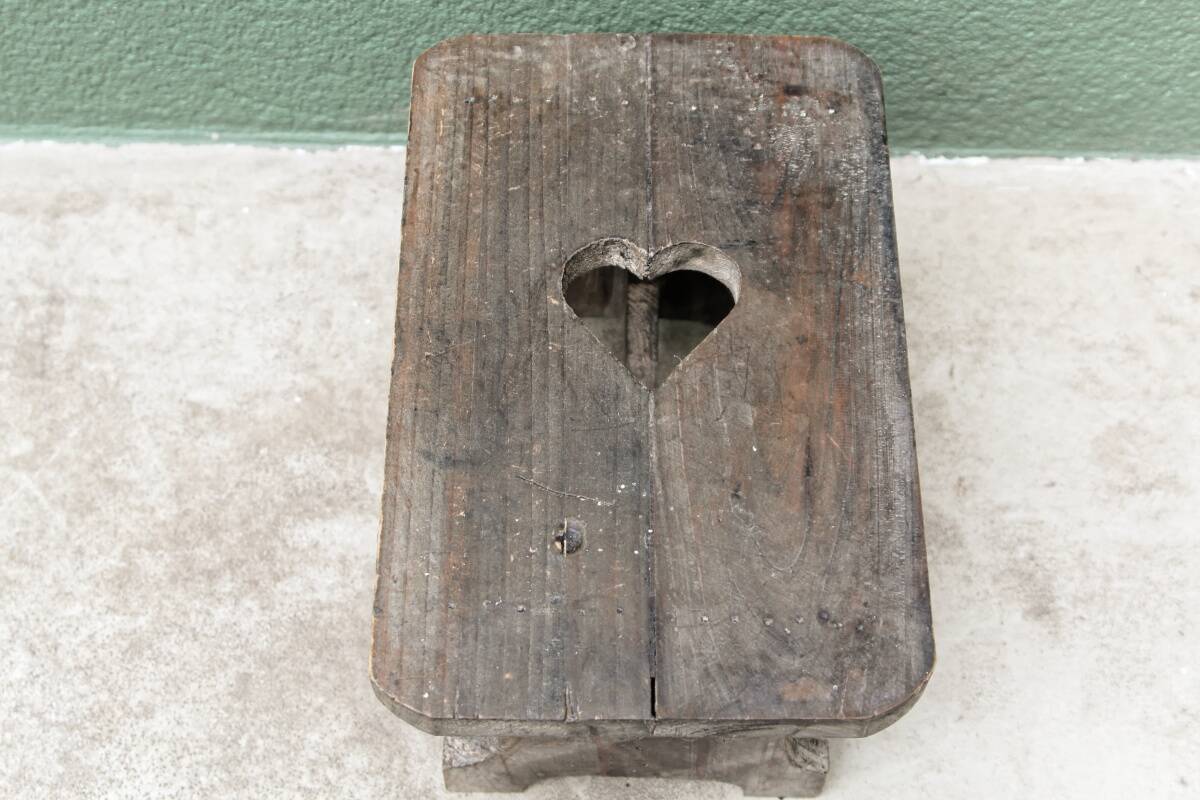 Wooden footrest, heart cutout