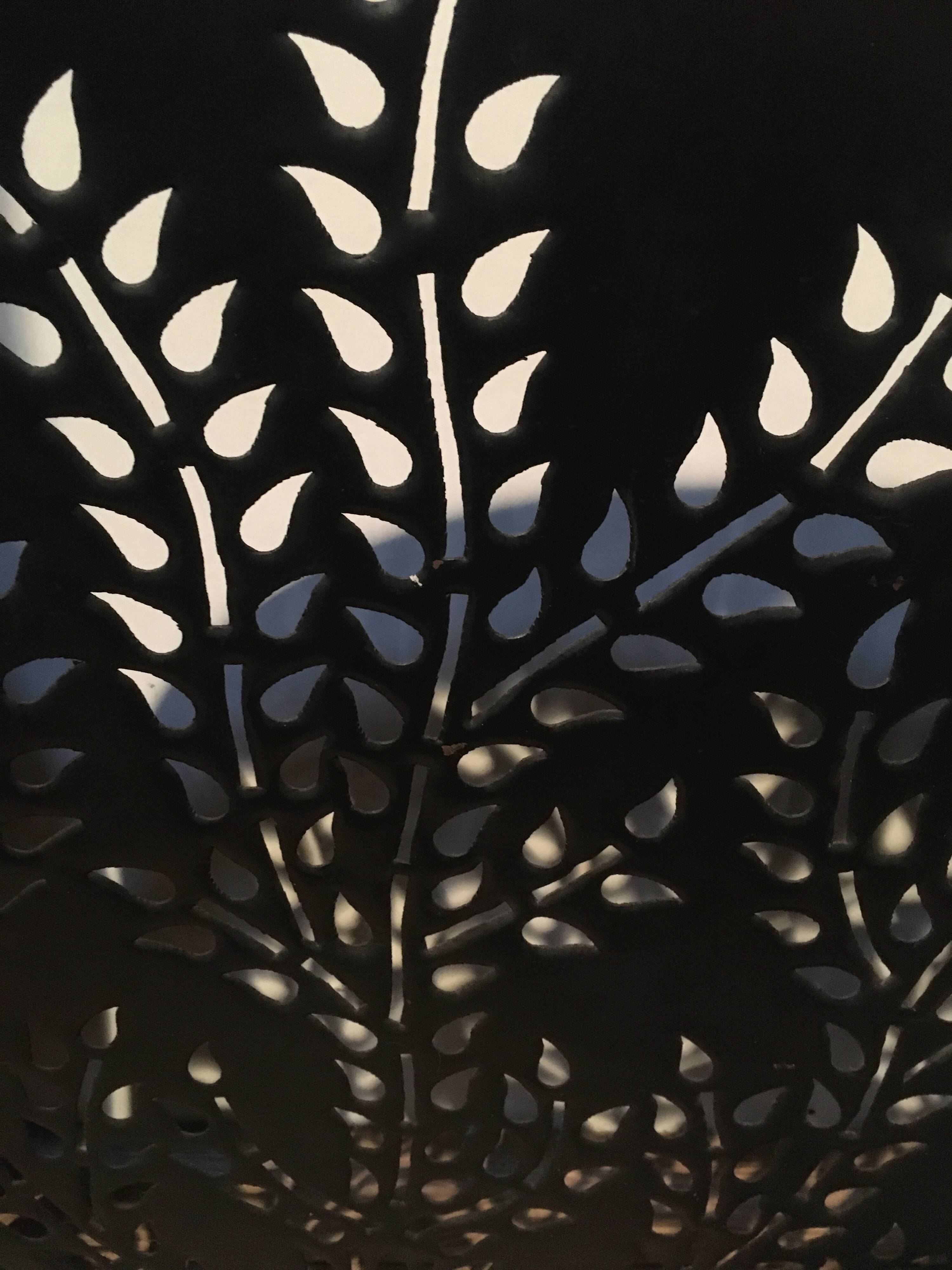 Wrought and cut metal fire screen