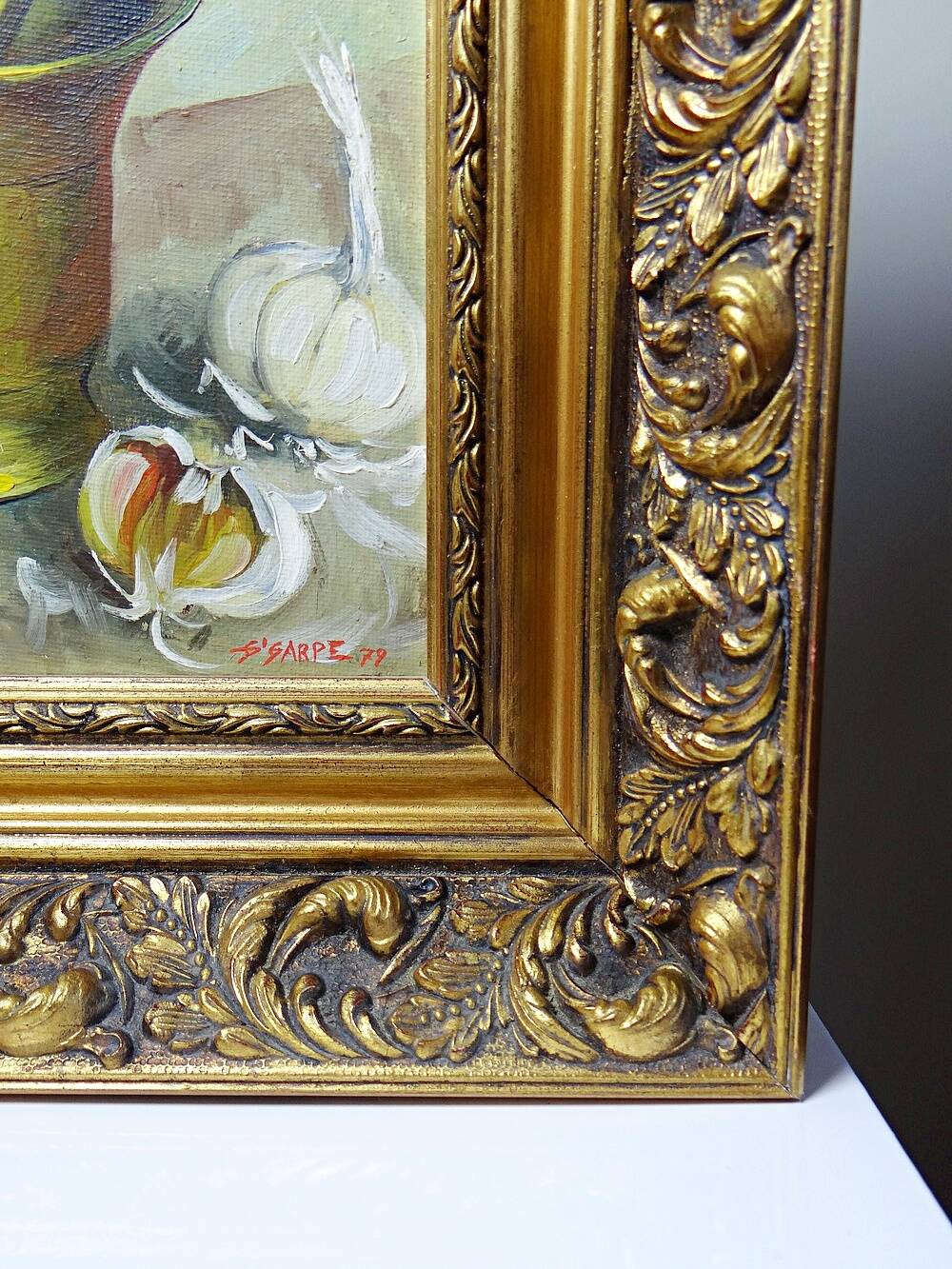 Still life with garlic, egg, and mortar signed Sarpe, 1979, oil on canvas.