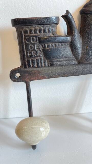Coat rack made of steel and porcelain