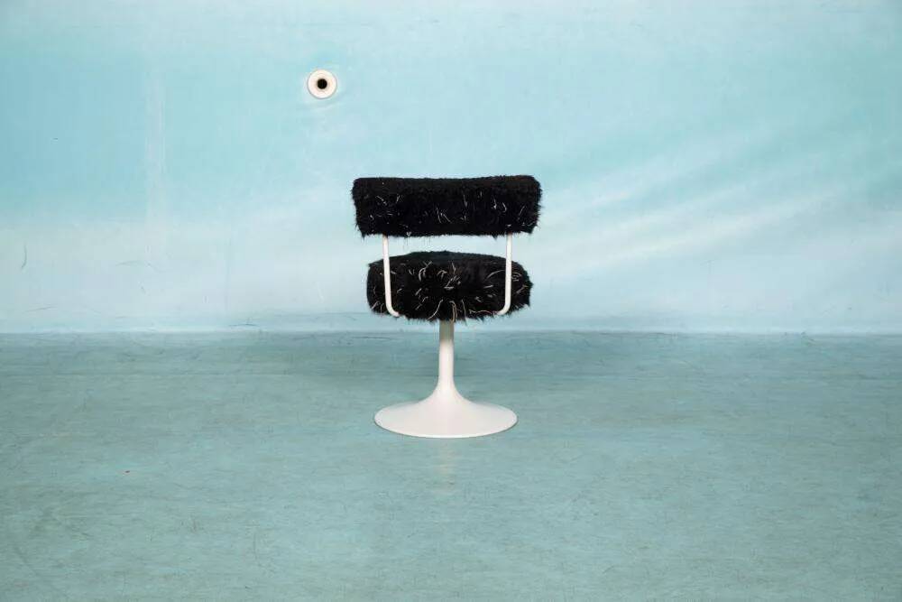 Space age design armchair from the sixties, fluffy stool with trumpet base.